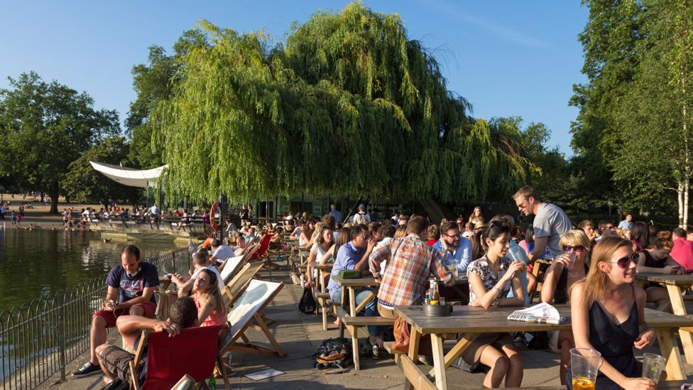 People relax on a summer day in Hyde Park (Credit: Robert Stainforth/Alamy) People relax on a summer day in Hyde Park (Credit: Robert Stainforth/Alamy)