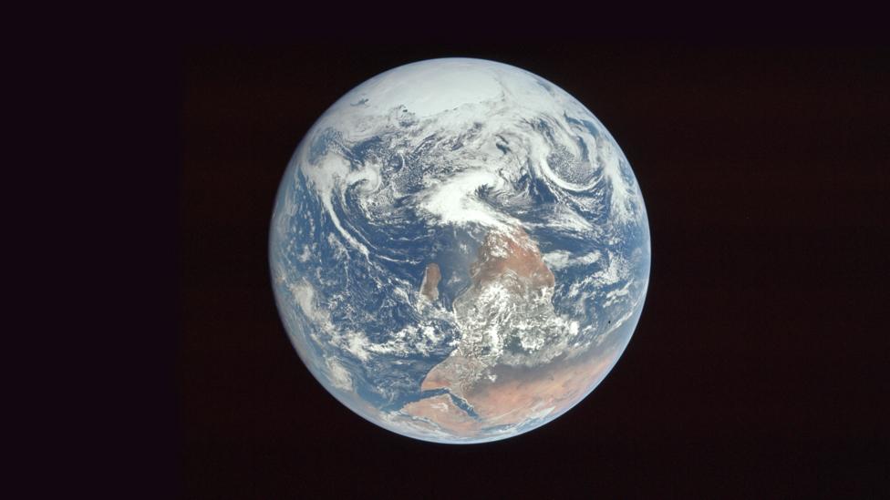 This image of Earth was photographed this way round, but flipped before publication (Credit: Nasa) This image of Earth was photographed this way round, but flipped before publication (Credit: Nasa)
