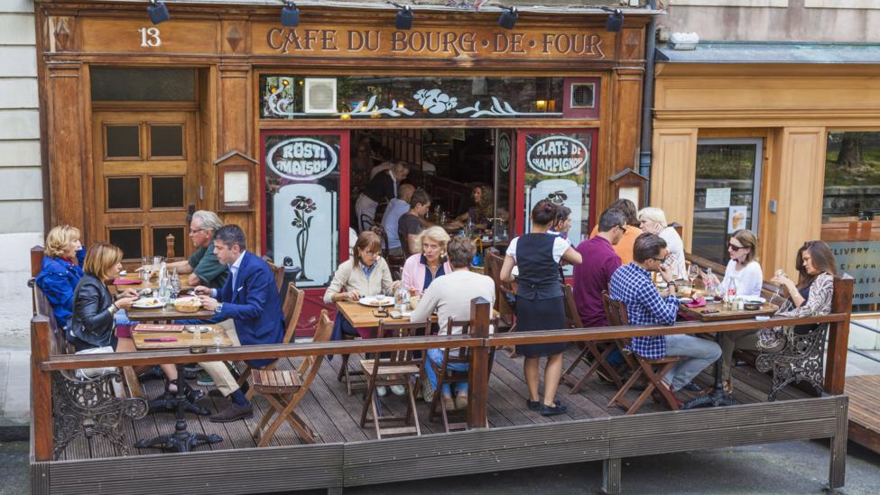 Dining out can be more expensive than other European cities. Cafe culture at Place du Bourg-de-Four, Geneva (Werner Dieterich/ Getty Images) Dining out can be more expensive than other European cities. Cafe culture at Place du Bourg-de-Four, Geneva (Werner Dieterich/ Getty Images)