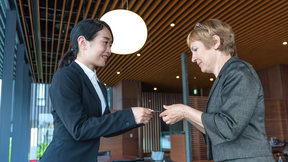 Business women exchanging cards in Kyoto, Japan (Credit: Pavliha/ Getty Images) Business women exchanging cards in Kyoto, Japan (Credit: Pavliha/ Getty Images)