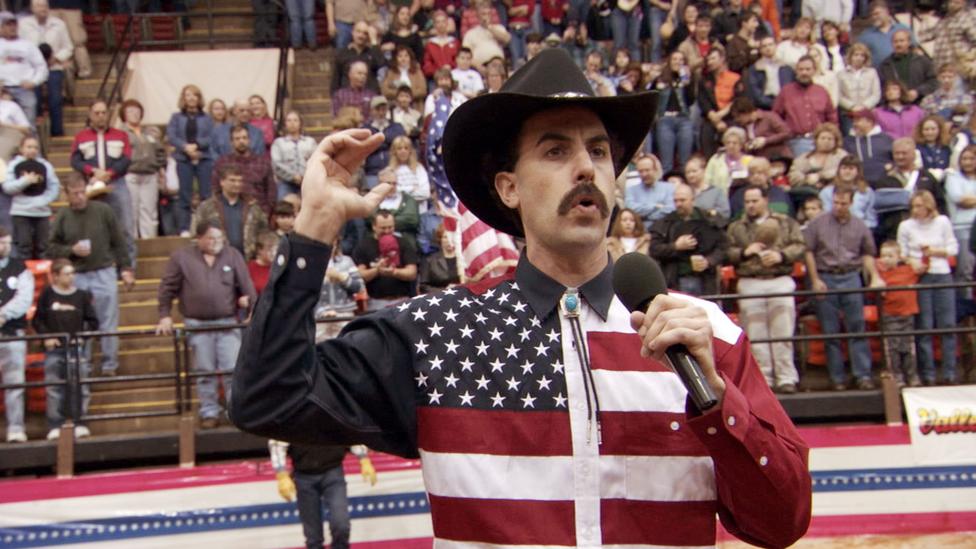 At a US rodeo Borat elicited applause when he declared, “May your George Bush drink the blood of every man, woman and child in Iraq” (Credit: Alamy) At a US rodeo Borat elicited applause when he declared, “May your George Bush drink the blood of every man, woman and child in Iraq” (Credit: Alamy)