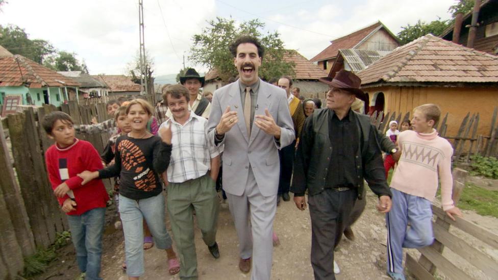 Baron Cohen acts bigoted in order to expose the bigotry in others, such as when he convinced patrons at a US bar to sing the lyrics “Throw the Jew down the well” (Credit: Alamy) Baron Cohen acts bigoted in order to expose the bigotry in others, such as when he convinced patrons at a US bar to sing the lyrics “Throw the Jew down the well” (Credit: Alamy)