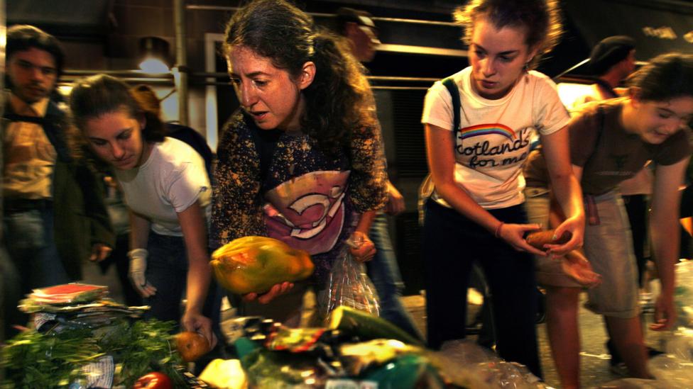 A growing number of people go dumpster diving, taking discarded food from bins outside restaurants and supermarkets (Credit: Getty Images) A growing number of people go dumpster diving, taking discarded food from bins outside restaurants and supermarkets (Credit: Getty Images)