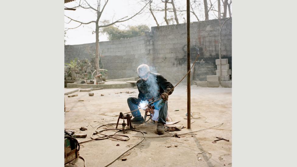 After a thief stole his airframe and engine to sell as scrap iron, Cao Zhengshu has a bed in his shed and sleeps there every night to watch over his aircraft. (Credit: Xiaoxiao Xu) After a thief stole his airframe and engine to sell as scrap iron, Cao Zhengshu has a bed in his shed and sleeps there every night to watch over his aircraft. (Credit: Xiaoxiao Xu)