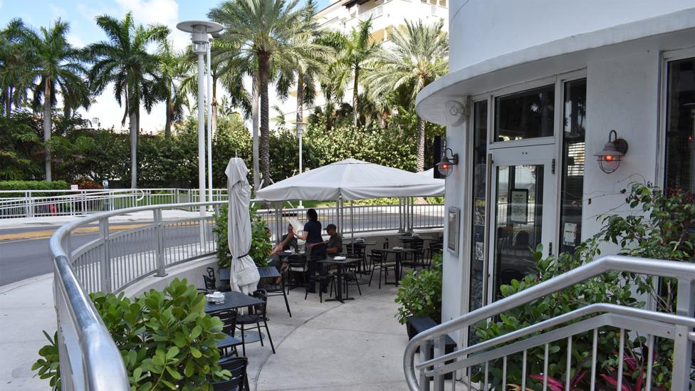 When Miami Beach raised its roads, a number of businesses, like the restaurant shown here, found themselves below street level (Credit: Amanda Ruggeri) When Miami Beach raised its roads, a number of businesses, like the restaurant shown here, found themselves below street level (Credit: Amanda Ruggeri)