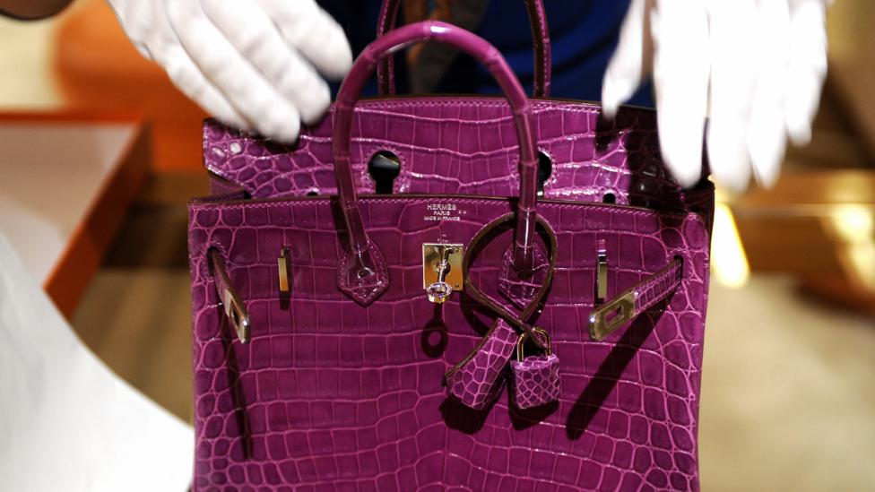 As more middle-class consumers own big TVs and fancy handbags, the rich are looking for different ways to show off their social position (Credit: Getty Images) As more middle-class consumers own big TVs and fancy handbags, the rich are looking for different ways to show off their social position (Credit: Getty Images)