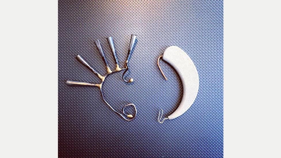 A comparison of Canaria's early prototype casing with a punk jewellery ear cuff, one of the inspirations behind the distinctive design (Credit: Alex Moss via Instagram) A comparison of Canaria's early prototype casing with a punk jewellery ear cuff, one of the inspirations behind the distinctive design (Credit: Alex Moss via Instagram)