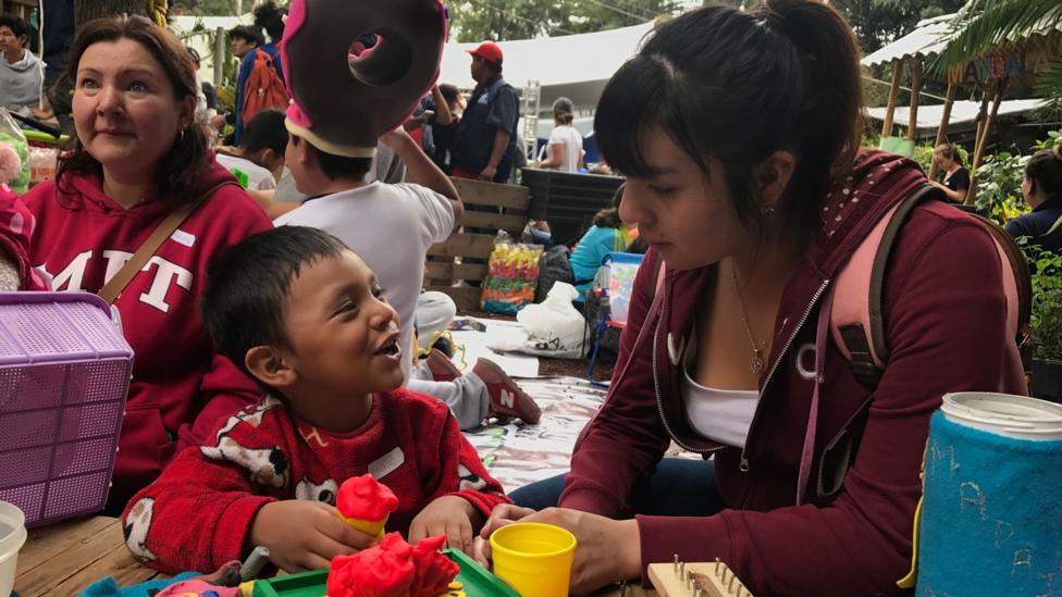 Karla Martínez, a pedagogy student at UNAM, plays with a Isaac, 4, at a shelter in Colonia Roma (Credit: Julissa Trevino) Karla Martínez, a pedagogy student at UNAM, plays with a Isaac, 4, at a shelter in Colonia Roma (Credit: Julissa Trevino)