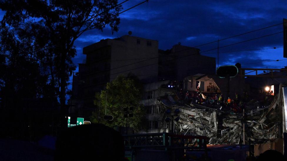 A search for survivors continues as night falls (Credit: Getty Images) A search for survivors continues as night falls (Credit: Getty Images)