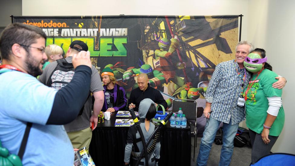 Rob Paulsen poses with a fan at a convention. He voiced Raphael in the original Teenage Mutant Ninja Turtles and Donatello in the recent remake (Credit: Getty Images) Rob Paulsen poses with a fan at a convention. He voiced Raphael in the original Teenage Mutant Ninja Turtles and Donatello in the recent remake (Credit: Getty Images)