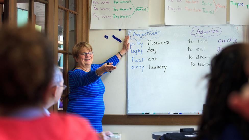 At a Massachusetts church, immigrants to the US sit in an English class (Credit: Getty Images) At a Massachusetts church, immigrants to the US sit in an English class (Credit: Getty Images)