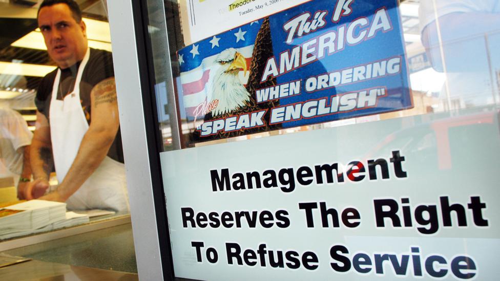 This sign hung in a Philadelphia sandwich shop in 2006, which provoked controversy - it was eventually removed from the window (Credit: Getty Images) This sign hung in a Philadelphia sandwich shop in 2006, which provoked controversy - it was eventually removed from the window (Credit: Getty Images)