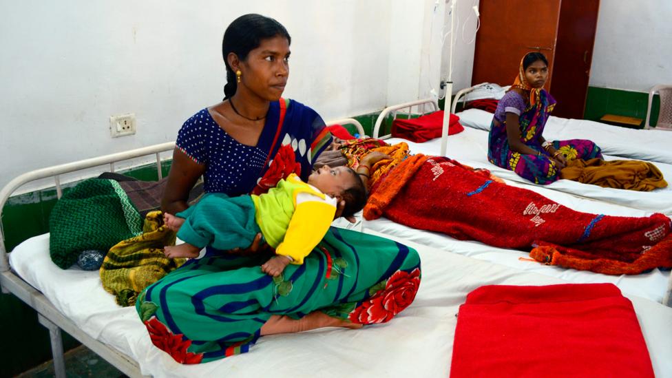 One of the women who suffered complications during the 2014 mass sterilisation that killed 13 women, Anita Bai tends to her child while under care in hospital (Credit: Getty) One of the women who suffered complications during the 2014 mass sterilisation that killed 13 women, Anita Bai tends to her child while under care in hospital (Credit: Getty)