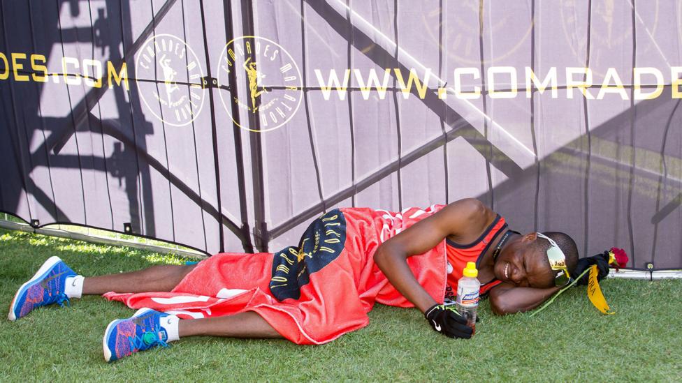 A runner lies on the ground after finishing South Africa’s 89.2km Comrades Marathon, one of the most gruelling ultramarathons in the world (Credit: Getty) A runner lies on the ground after finishing South Africa’s 89.2km Comrades Marathon, one of the most gruelling ultramarathons in the world (Credit: Getty)