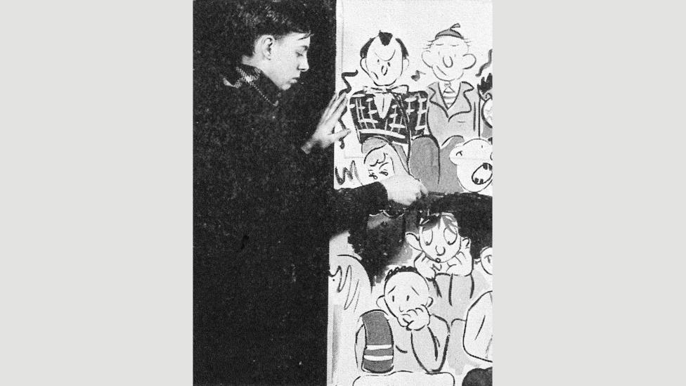 Gorey at work on a mural for a high-school social event, from the Parker Record yearbook (1942) (Credit: Francis W Parker School, Chicago) Gorey at work on a mural for a high-school social event, from the Parker Record yearbook (1942) (Credit: Francis W Parker School, Chicago)