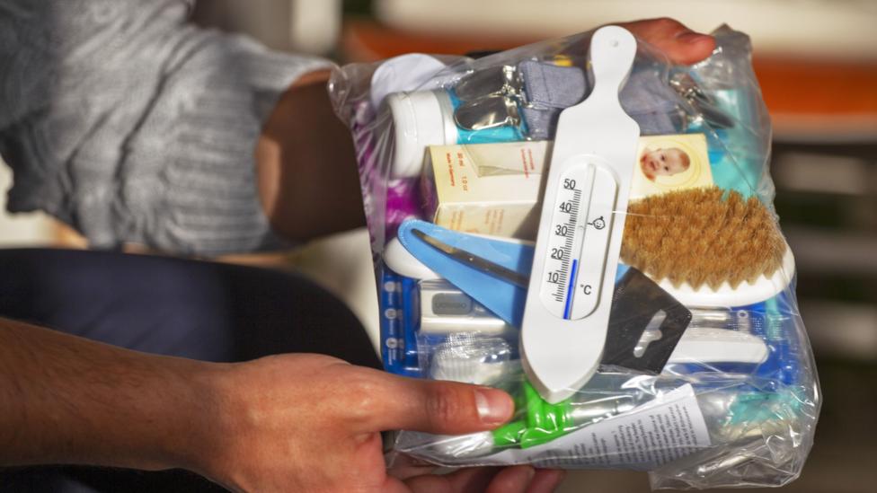 There are 63 items in the 2018 baby box including a baby toothbrush and 'huopattosut' felt baby booties in the colours of the Finnish flag. (Credit: Tuomas Selänne) There are 63 items in the 2018 baby box including a baby toothbrush and 'huopattosut' felt baby booties in the colours of the Finnish flag. (Credit: Tuomas Selänne)