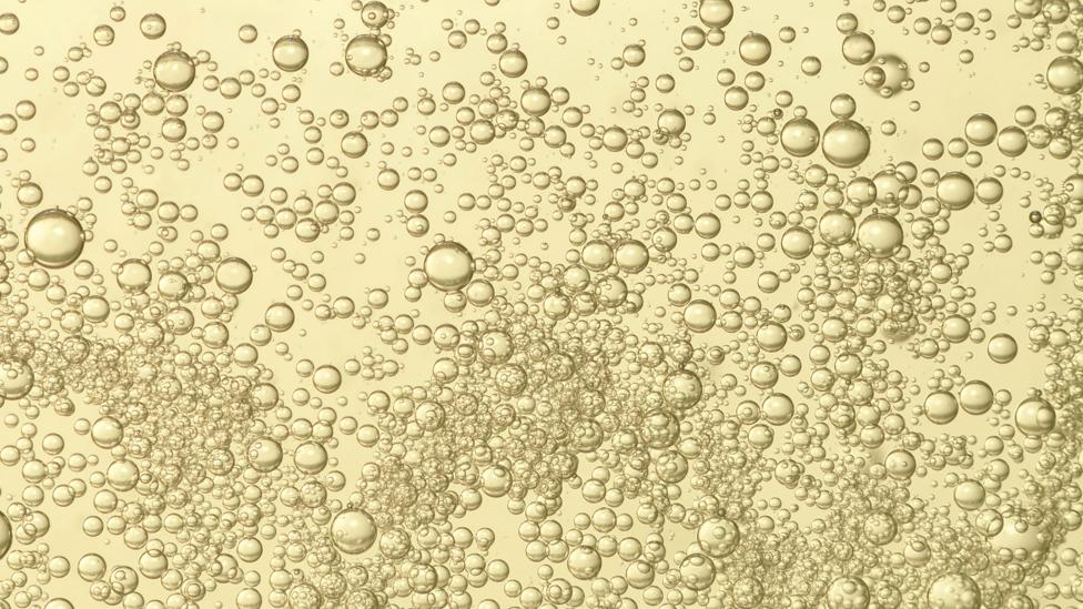 Each bottle of champagne contains up to five liters of carbon dioxide (Credit: Getty Images) Each bottle of champagne contains up to five liters of carbon dioxide (Credit: Getty Images)