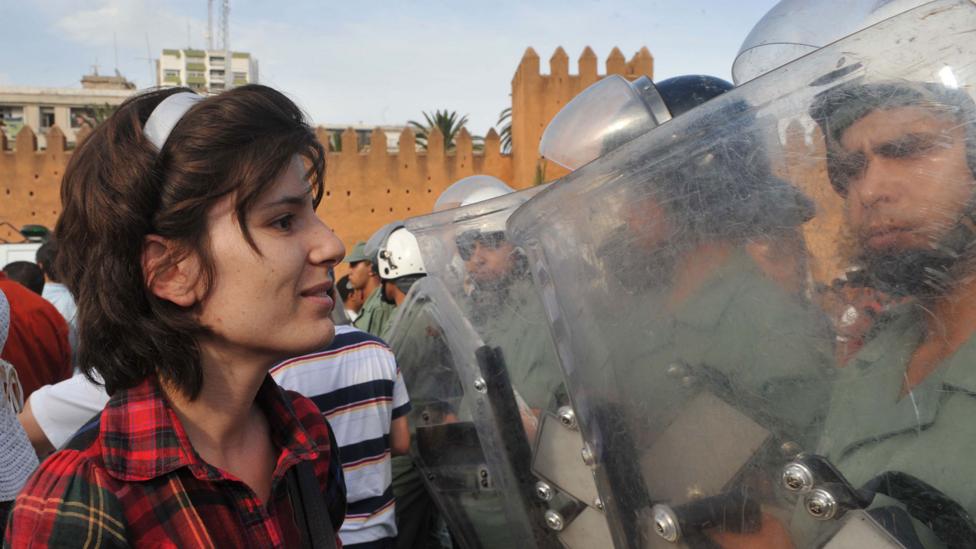 Nonviolent protests are more likely to attract support from across society. Here a pro-reform protestor faces security forces in Morocco in 2011 (Credit: Getty Images)