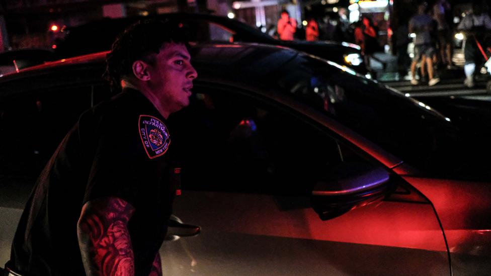 NYPD officer during power cut in Manhattan NYPD officer during power cut in Manhattan