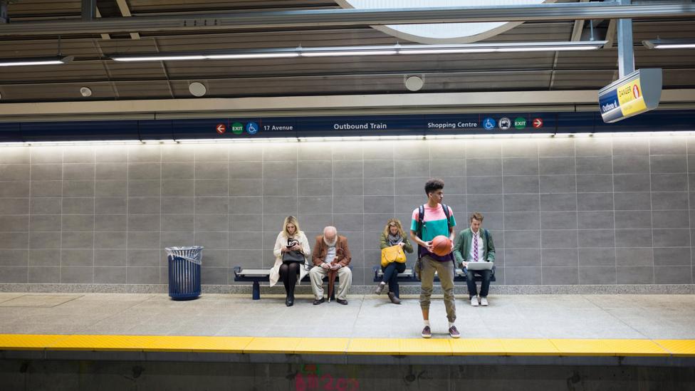 A group of people wait on a train platform (Credit: Alamy) A group of people wait on a train platform (Credit: Alamy)