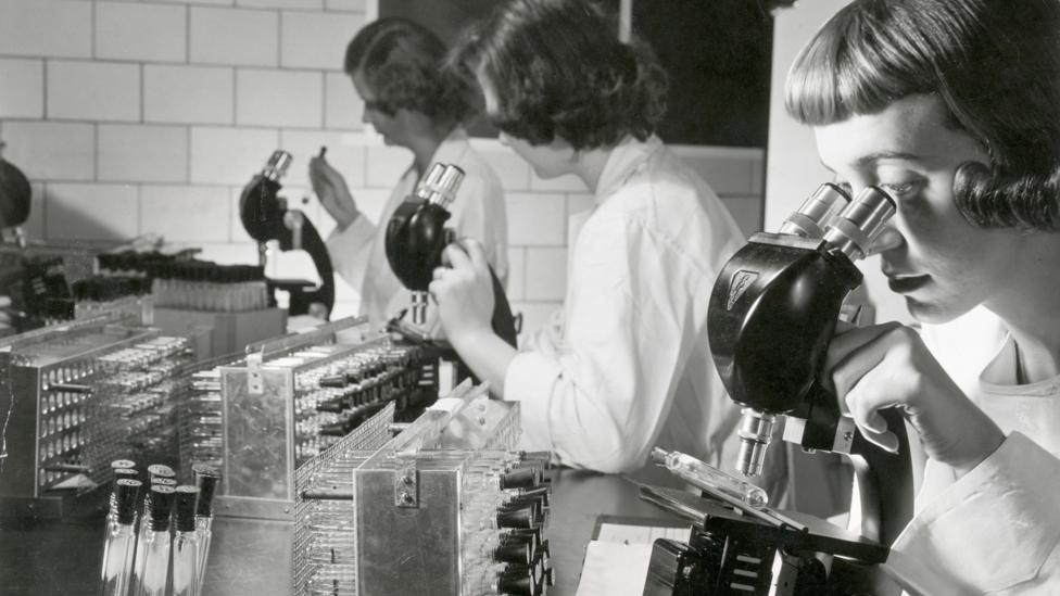 The polio vaccine, shown here studied by scientists in the 1950s, eliminated, in most of the world, a disease in that used to kill or disable millions (Credit: Getty Images)