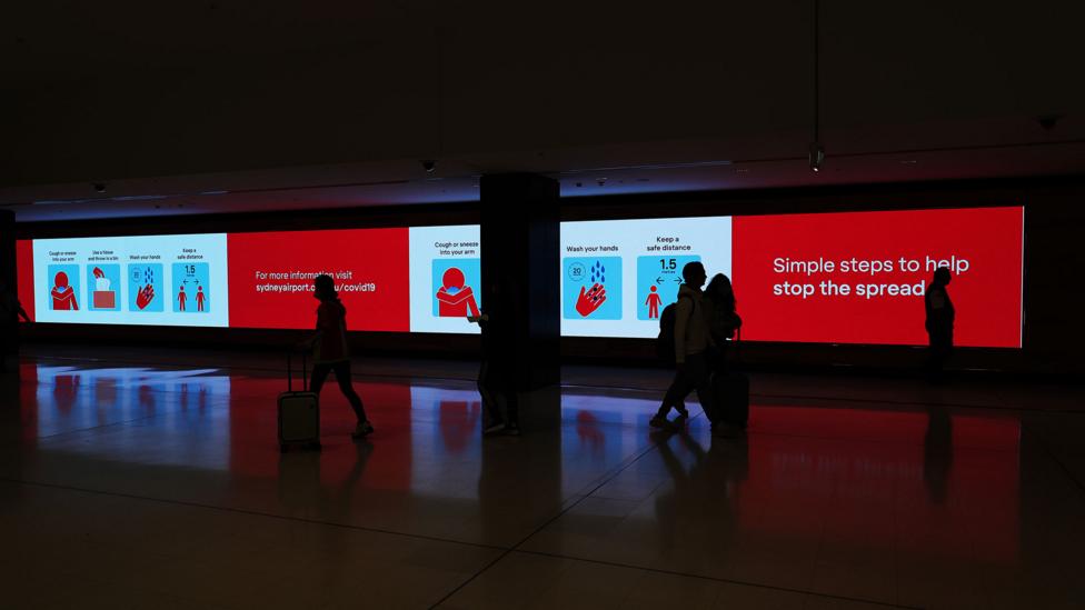 Warnings greet travellers at Sydney International Airport (Credit: Getty Images)