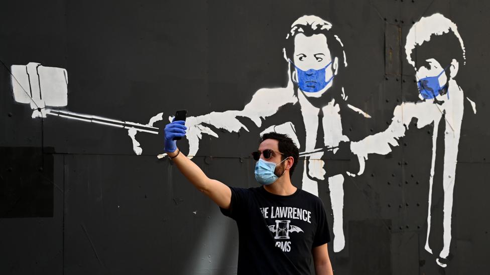 Face masks are likely to become a common part of life when out in public as lockdowns start to be lifted (Credit: Getty Images)
