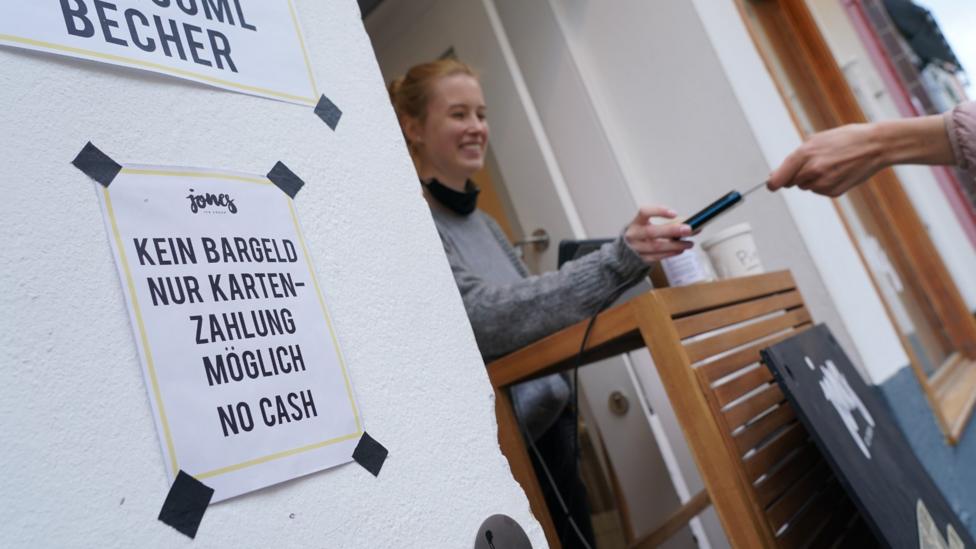 For the first time, some shops and businesses are actively discouraging cash payments