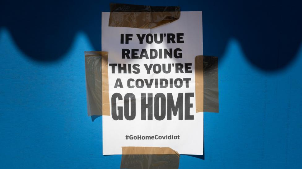 Innovative signs: In the UK, 'covidiots' is being used to described those ignoring social distancing rules